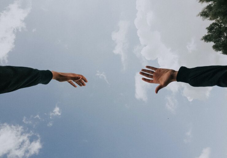 hands reaching out